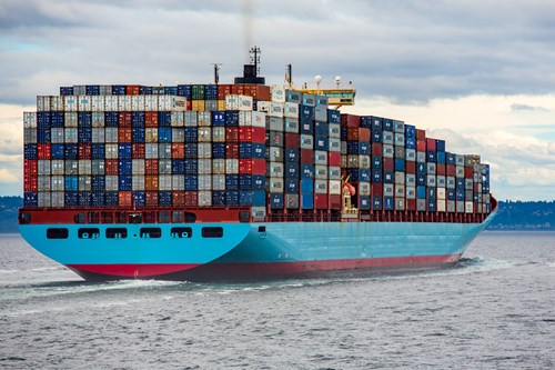 large blue loaded cargo container ship